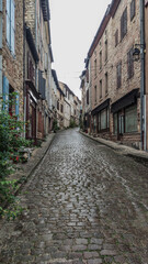 Old street in the medieval village of Cordes sur Ciel, in Tarn, Occitanie, France.
