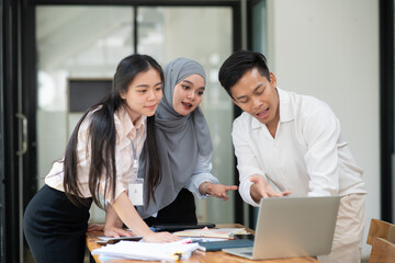 Asian businessmen, women and men Talk about new projects, presents at home office.