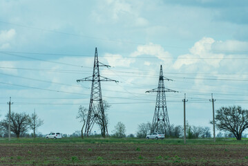High voltage towers with sky background. Power line support with wires for electricity...