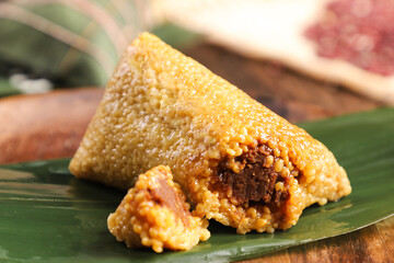 zongzi, rice dumplings,Made with glutinous rice and meat or egg yolk(Dates and Red Beans), wrapped...
