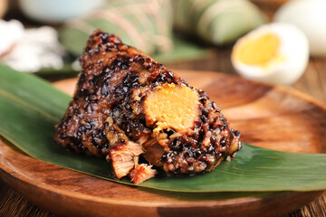 zongzi, rice dumplings,Made with glutinous rice and meat or egg yolk(Dates and Red Beans), wrapped in zong leaves, a common food for the Dragon Boat Festival in Asian countries.