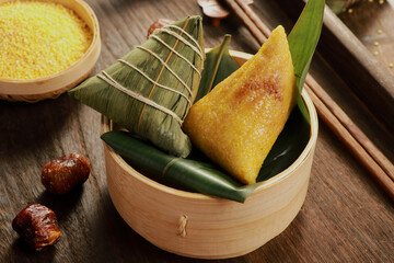 zongzi, rice dumplings,Made with glutinous rice and meat or egg yolk(Dates and Red Beans), wrapped in zong leaves, a common food for the Dragon Boat Festival in Asian countries.