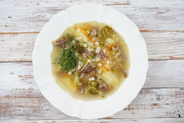 Soup with beef meat, pickled cucumbers and pearl barley.  Rassolnik- traditional Russian cuisine cucumber soup