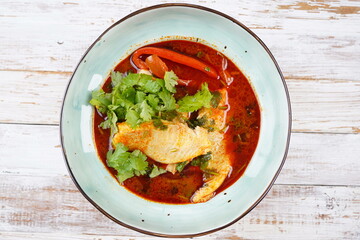 Moroccan fish  with chermoula, red peppers and preserved lemon. Spicy traditional  Moroccan food