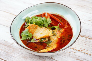 Moroccan fish  with chermoula, red peppers and preserved lemon. Spicy traditional  Moroccan food