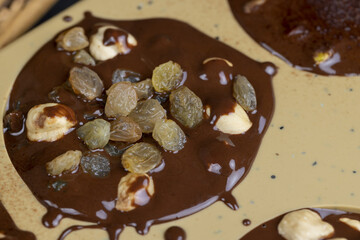making homemade chocolate with cocoa butter and nuts