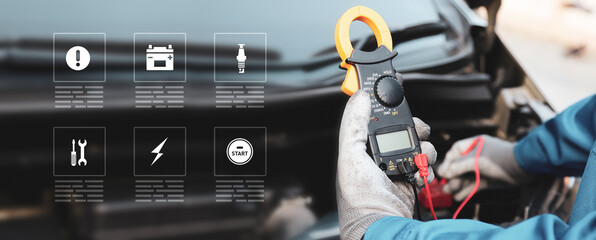 Close-up hand auto mechanic using meter to check car battery fail problem with service icons for...