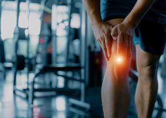 Close-Up of Man Holding Knee in Pain with Highlighted Injury