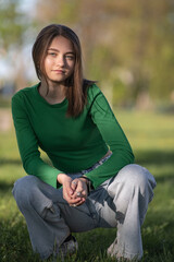 Portrait of a young beautiful long-haired girl outdoors.