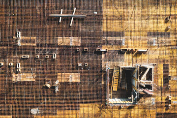 Top view of construction site with steel bars and reinforced concrete. Building in process.