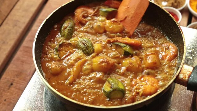 cooking pointed ground or potol or parwal shrimp curry with potato