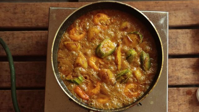 cooking pointed ground or potol or parwal shrimp curry with potato