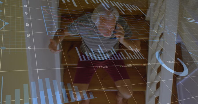 Image of graphs and numbers, senior caucasian man sitting on staircase and talking on cellphone - Powered by Adobe