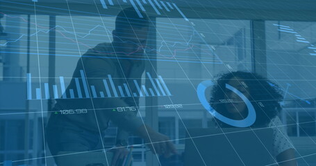 Image of graphs, changing numbers, loading circles over diverse coworkers discussing reports