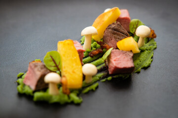 Gourmet dish styled to mimic a forest, showcasing culinary artistry