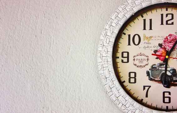 Vintage wall clock positioned left and right on the gray wall. Paris themed wall clock with copy or text space.