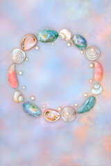 Shell and pearl abstract wreath with collection of shells on rainbow sky background. Natural summer nature design, beach and seaside art.