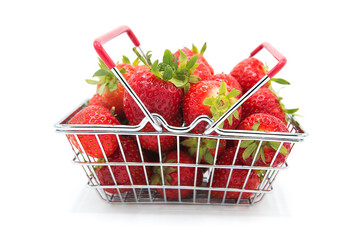 Shopping supermarket basket with fresh organic ripe strawberries isolated on a white background....