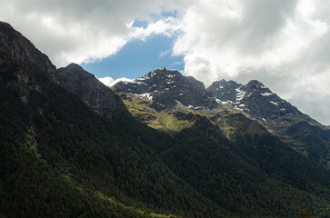 mountain range with snow capped peak and clouds, New Zealand