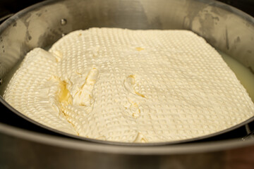 Maturation of Italian mozzarella cheese. Close-up