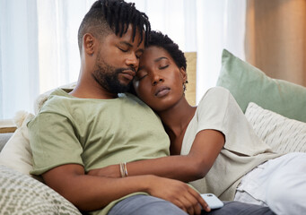 Fototapeta premium African couple and sleeping together with hug on sofa for rest, relax and bonding in living room. Relationship, man and woman in marriage with love embrace on couch for comfort, peace and support