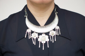 Close up woman in black blouse wears handmade silver necklace hill tribe style. Concept, accessory...