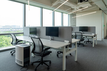 Interior of modern empty office building.Open ceiling design.Equipped with automatic lifting table and LCD screen.