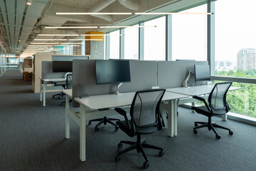 Interior of modern empty office building.Open ceiling design.Equipped with automatic lifting table and LCD screen.