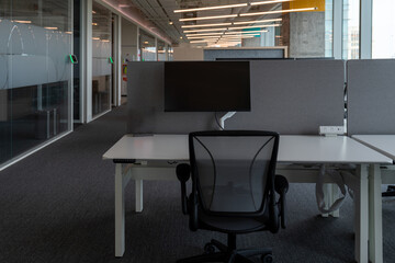 Interior of modern empty office building.Open ceiling design.Equipped with automatic lifting table and LCD screen.