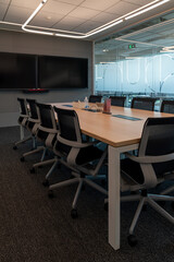 Interior of modern empty office building.Open ceiling design.Equipped with automatic lifting table and LCD screen.