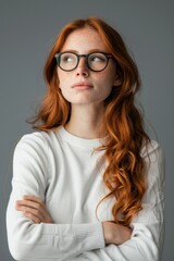 Fototapeta premium Woman With Red Hair Wearing Glasses
