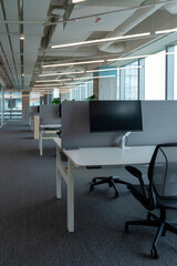 Interior of modern empty office building.Open ceiling design.Equipped with automatic lifting table and LCD screen.
