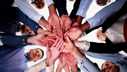 Directly Below Creative Business Team Stacking Hands