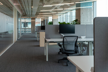 Interior of modern empty office building.Open ceiling design.Equipped with automatic lifting table and LCD screen.