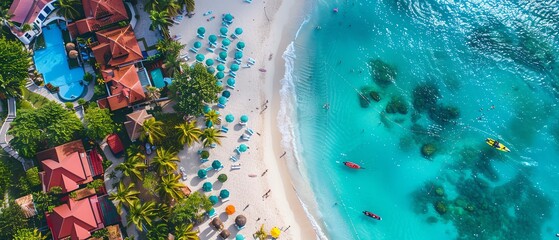 Aerial view of a tropical beach with turquoise waters, sun loungers, and lush greenery. Ideal for...