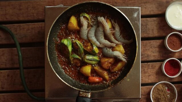 cooking pointed ground or potol or parwal shrimp curry with potato