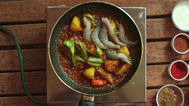cooking pointed ground or potol or parwal shrimp curry with potato