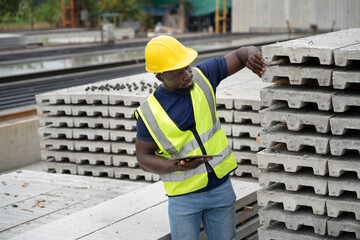 Portrait African engineer man working at precast cement outdoor factory	