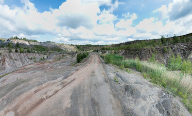 Open-pit mining sounds like a giant sandbox for adults, doesn't it? Imagine huge machines that look like oversized toy excavators