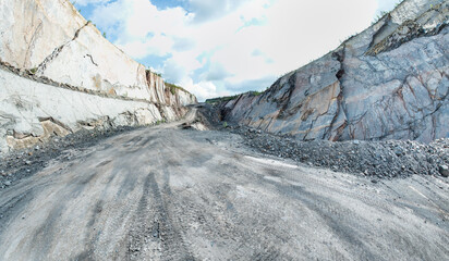Open-pit mining sounds like a giant sandbox for adults, doesn't it? Imagine huge machines that look like oversized toy excavators