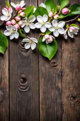 Fototapeta premium Spring blooming branches on wooden background. Apple blossoms