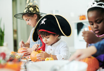 Group, children and pirate costume for halloween, birthday or party at event as kids to celebrate. Youth, creative and pumpkins for decor, fantasy and holiday tradition in America for playing in home