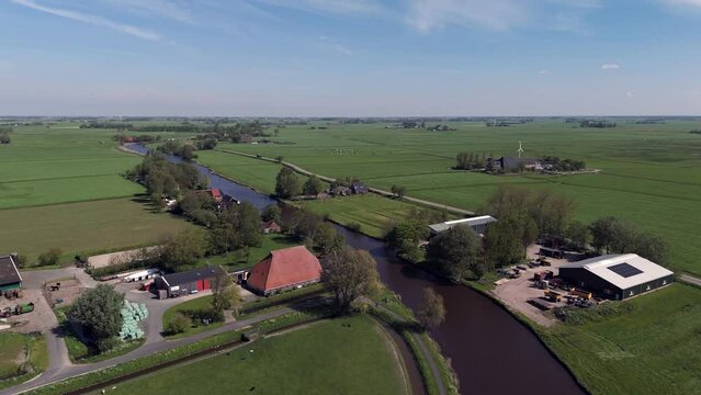 Aerial View: Dokkumer Ee River/Cannel through Farmland in Friesland, Netherlands