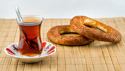 Turkish Tea in Glass Cup with Sesame Simit: Traditional Quick Turkish Breakfast. Çay ve simit