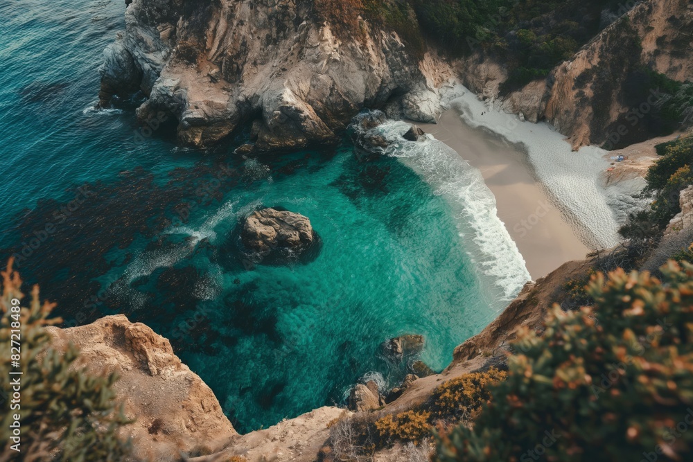Poster aerial view of a tranquil hidden beach with pristine waters surrounded by rugged cliffs