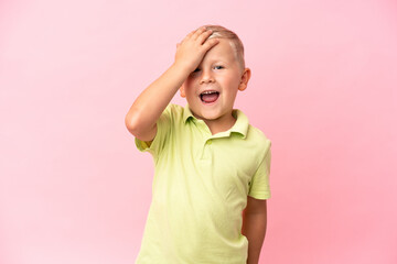 Little Russian boy isolated on pink background has realized something and intending the solution