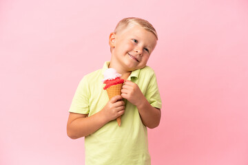 Little Russian boy with a cornet ice cream over isolated background