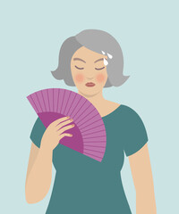 Woman cooling herself with fan, hot flashes, menopause symptoms.