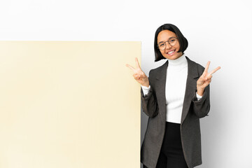 Young business mixed race woman with with a big banner over isolated background showing victory sign with both hands