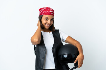 Young woman holding a motorcycle helmet isolated on white laughing